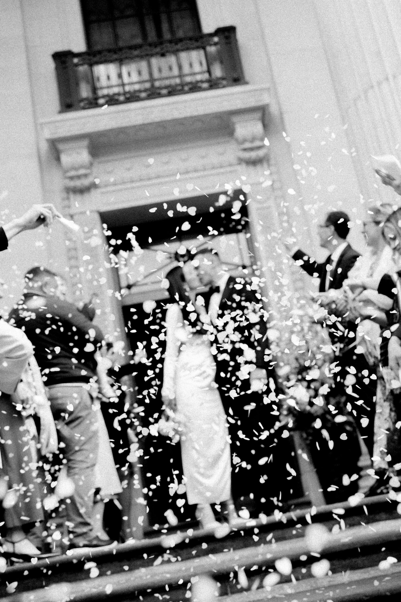 Newlyweds walking down the steps of Old Marylebone Town Hall after their ceremony